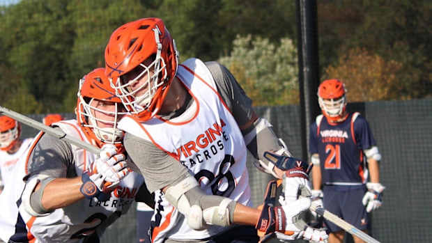 Jack Boyden dodges during Virginia men's lacrosse practice.